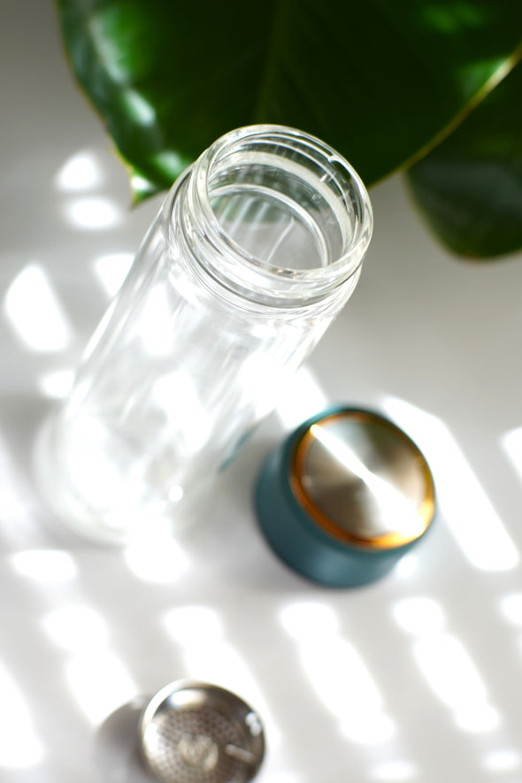 glass bottle with a blue cap 